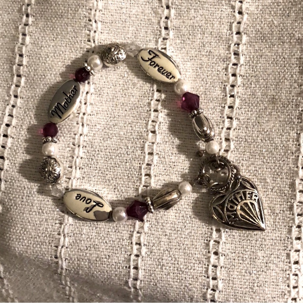 Silver tone bracelet for “Mother”.
